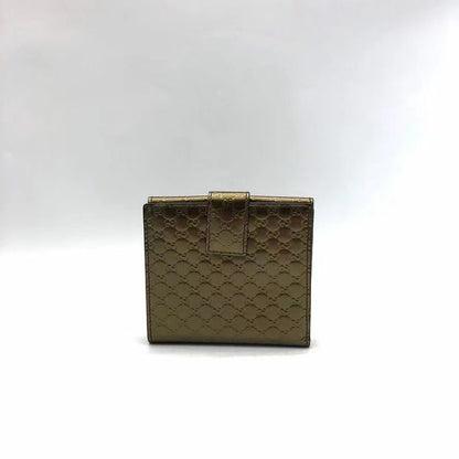 Vintage Gucci Metallic Gold Monogram Wallet With Heart Logo Detailing