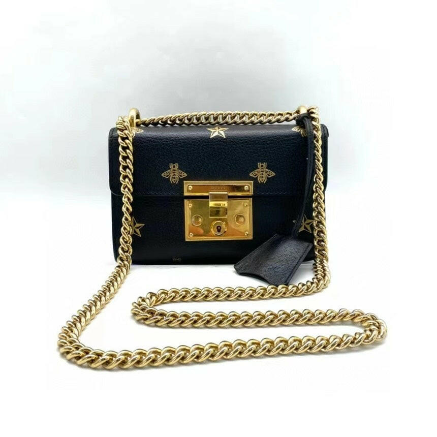 Gucci Padlock Black Leather Mini Shoulder Bag with Gold Chain Strap and Bee Star Embellishments.