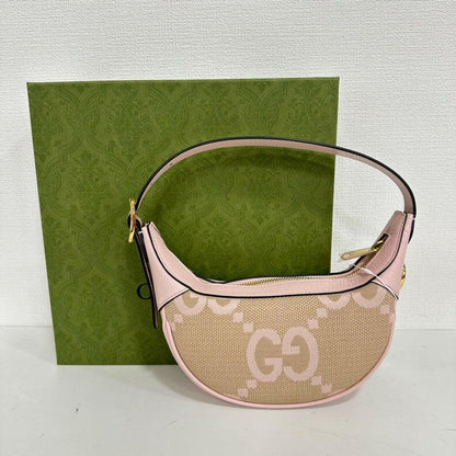 Gucci GG Canvas Leather Hobo Bag in Beige and Pink - Medium Size.