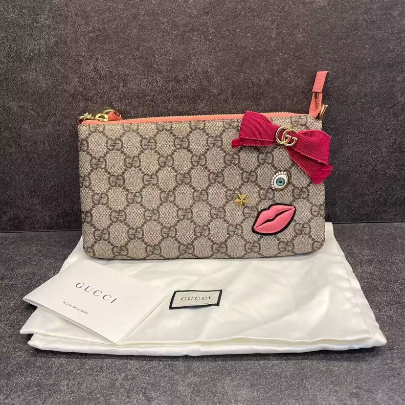 Gucci Ophidia GG Canvas Gray Pochette with Red Bow Embellishment