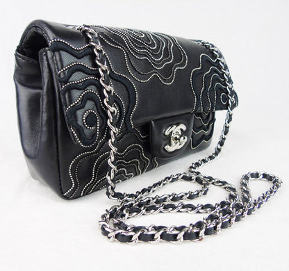 CHANEL 'Follies' black flap bag