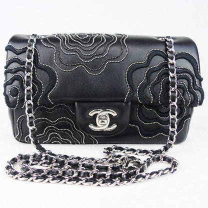 CHANEL 'Follies' black flap bag